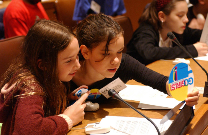 Young girls participate in a meeting at the UN.