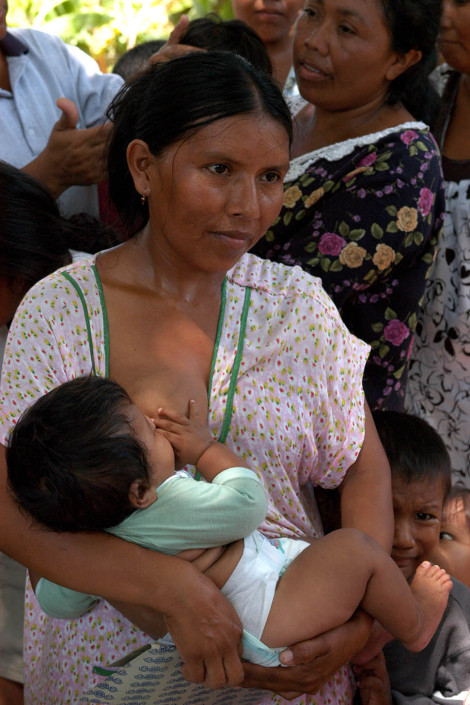 An indigenous Wayuu woman breastfeeds her infant as she waits in line to have her seven children vaccinated at an immunization drive in Maracaibo, Venezuela.