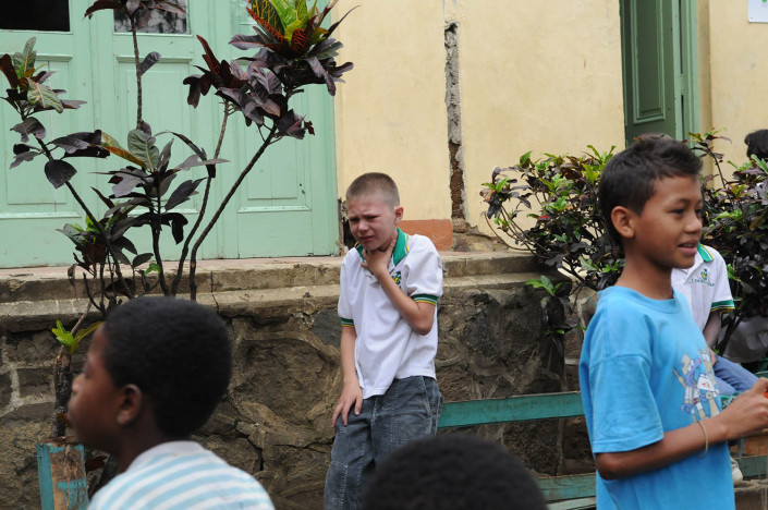 A boy is bullied outside a school in Medellin, Colombia.