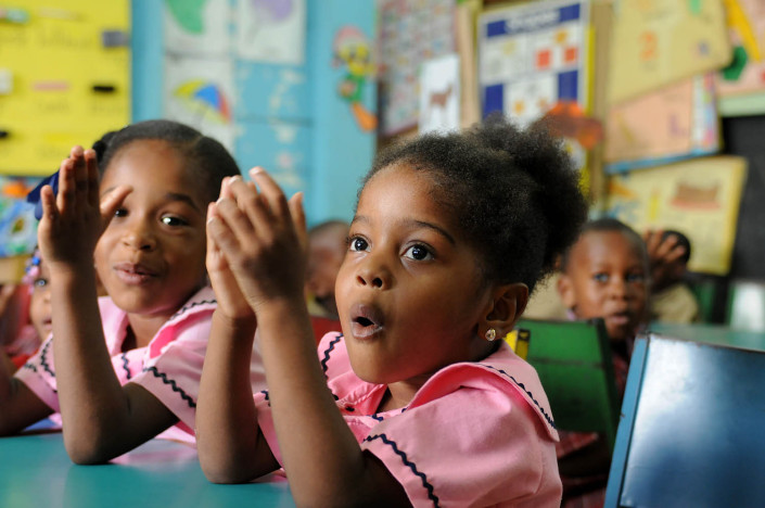 A girl recites the alphabet with her class at the Denham Town Basic School in the Denham Town community in the parish of Kingston and St. Andrew, Jamaica.