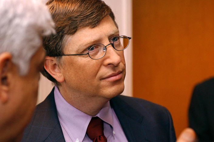 Bill Gates has a conversation with participants at a morning meeting