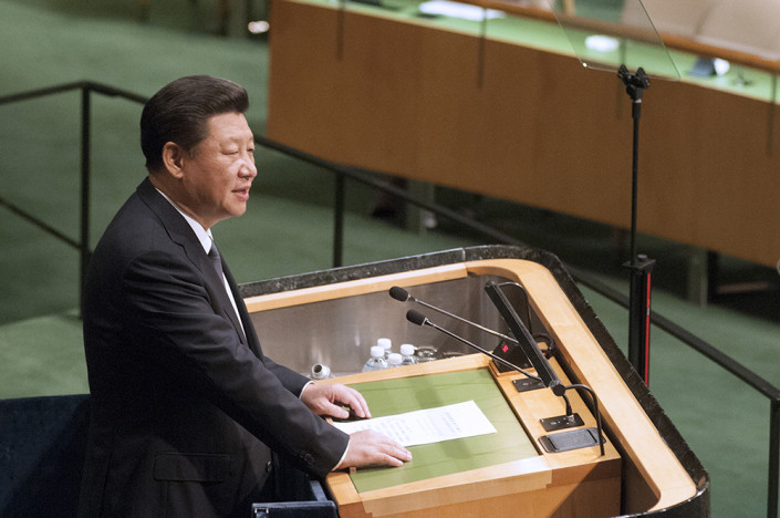 Close-up photo of Chinese President Xi Jinping speaking at the podium of the United Nations General Assembly.