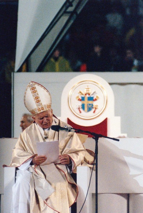Pope John Paul II, wearing a mitre, reads a sermon during Mass in the Meadowlands, New Jersey in 1995.