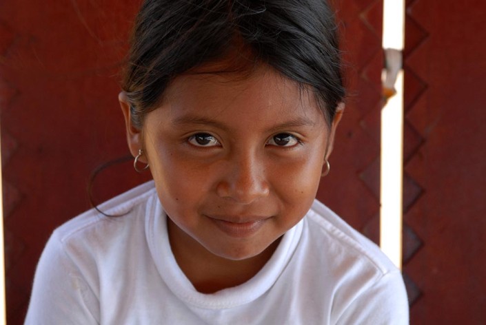 Close-up photograph of a 10-year-old indigenous Añu girl in Laguna de Sinamaica, Venezuela.