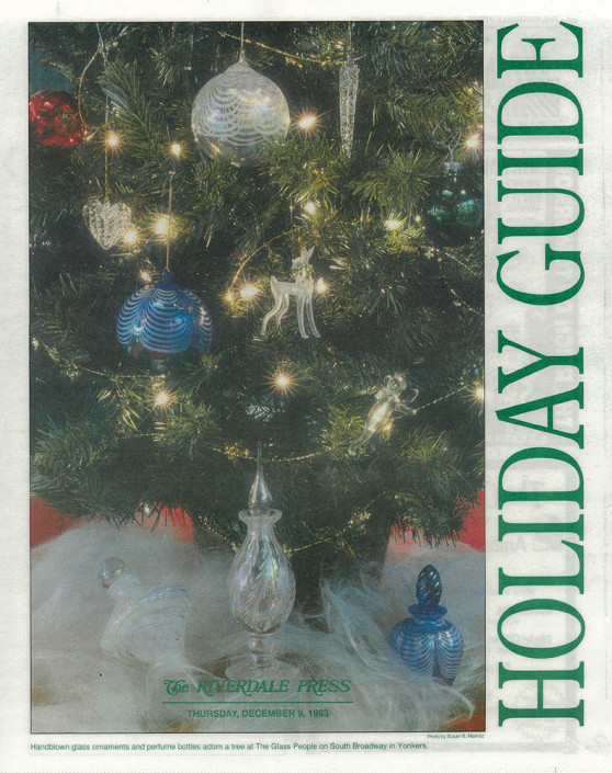 Newspaper holiday guide featuring a Christmas tree and handblown glass ornaments.