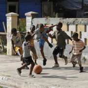 Boys play football on the street in the community of Trenchtown in the parish of Kingston and St. Andrew, Jamaica.