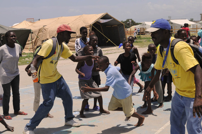 Children participate in organized games at Carrefour Aviation, a tent camp housing 50,000 people who were displaced by the 7.3 magnitude earthquake on 12 January in Haiti.