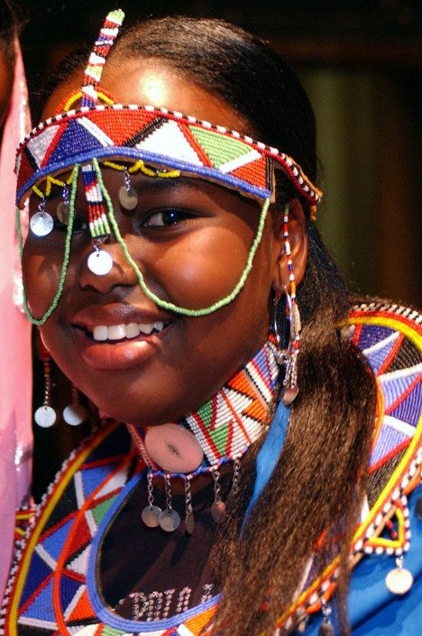 Kenyan child delegate in indigenous dress.