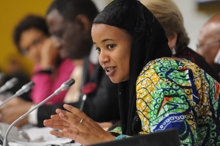 Nigerian youth activist Salamatou AghaliIssoufa, 22, wearing a black head scarf, addresses the UN on ending child marriage.