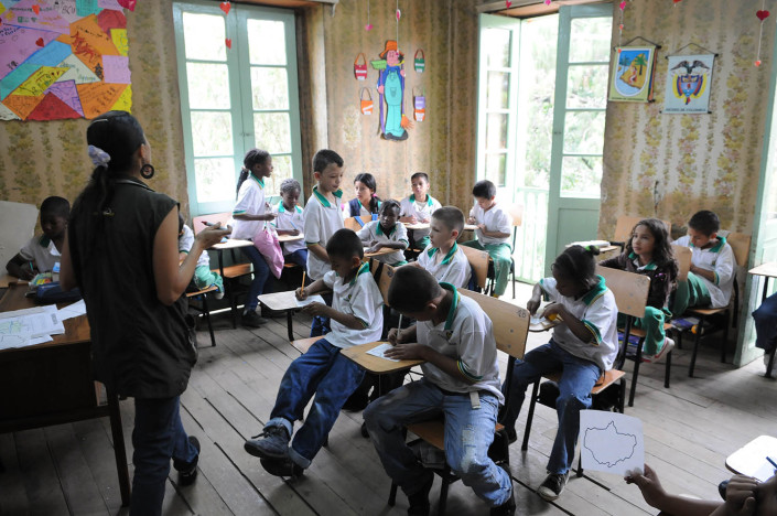Second-grade students study geography in a neighborhood in Medillin, Colombia.