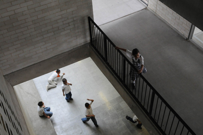 Children play in the hallways of their elementary school in Medellin, Colombia.