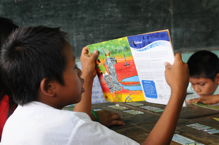 A boy reads a book in a language class in the indigenous Shipibo-Conibo community of Nuevo Saposoa in the Peruvian Amazon.