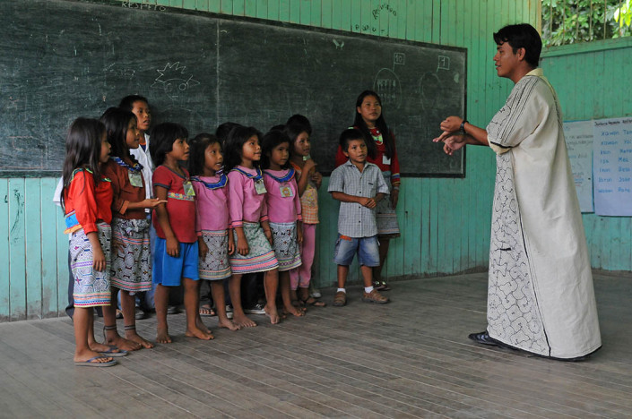 A teacher instructs students in the indigenous Shipibo-Conibo community of Nuevo Saposoa in the Peruvian Amazon.