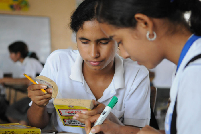 Adolescent girls study English in their 11th grad class in Lorica, Colombia.