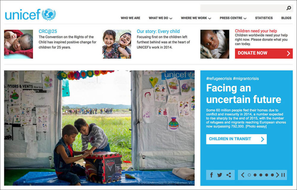 Screen capture of a web page photo of refugee boys playing at a transit centre for refugees and migrants, on unicef.org