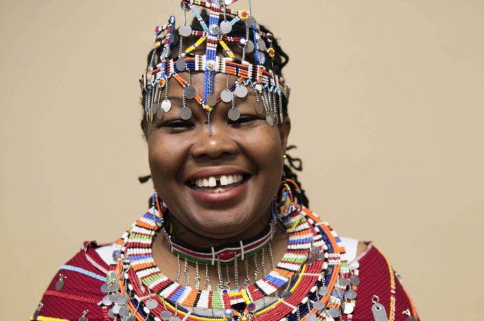 Portrait of a smiling Masai woman wearing traditional and colorful wedding costume