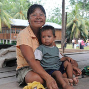 A mother and her son sit inside their home in the indigenous Shipibo-Conibo community of Nuevo Saposoa in the eastern province of Coronel Portillo in Ucayali Region in the Peruvian Amazon. ©UNICEF/2010/Susan Markisz